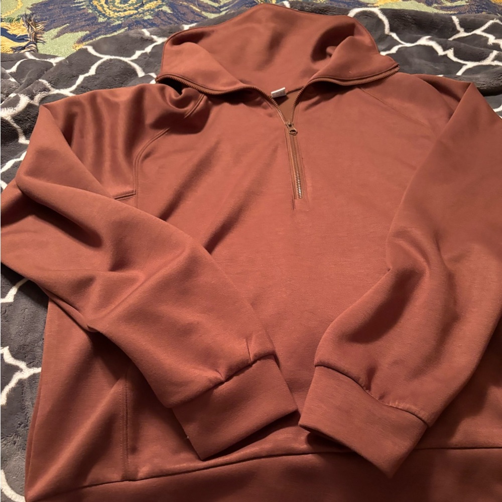 Super soft zip sweater with large collar and long sleeves.